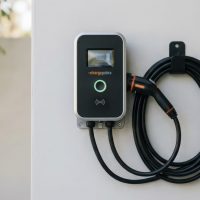 Electric vehicle charging station mounted on a wall