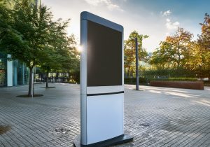 This outdoor kiosk features a white stand, interactive touch screen, and realistic 3D display for convenient self-service information.